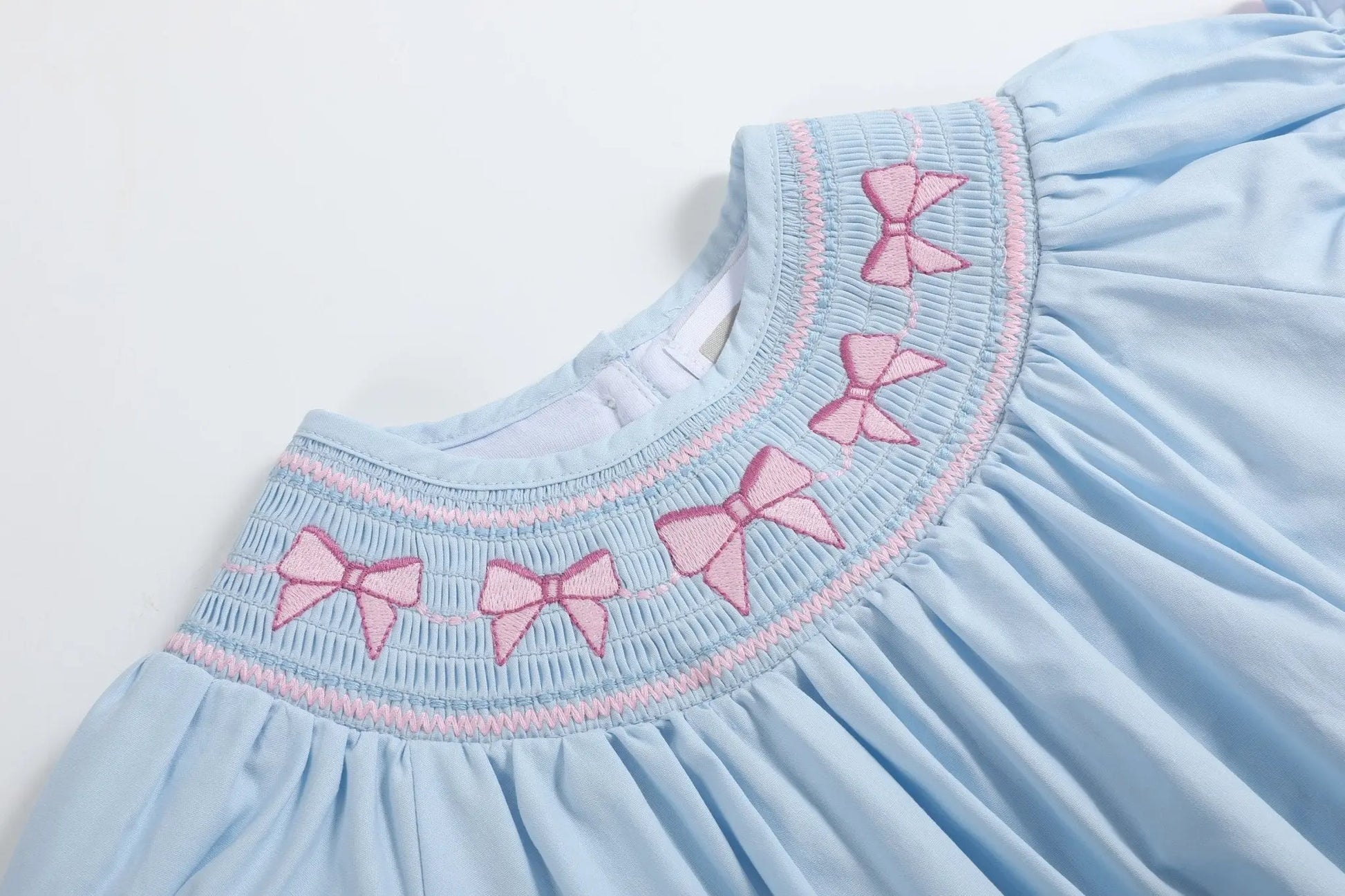 Blue and Pink Bow Smocked Romper Lil Cactus