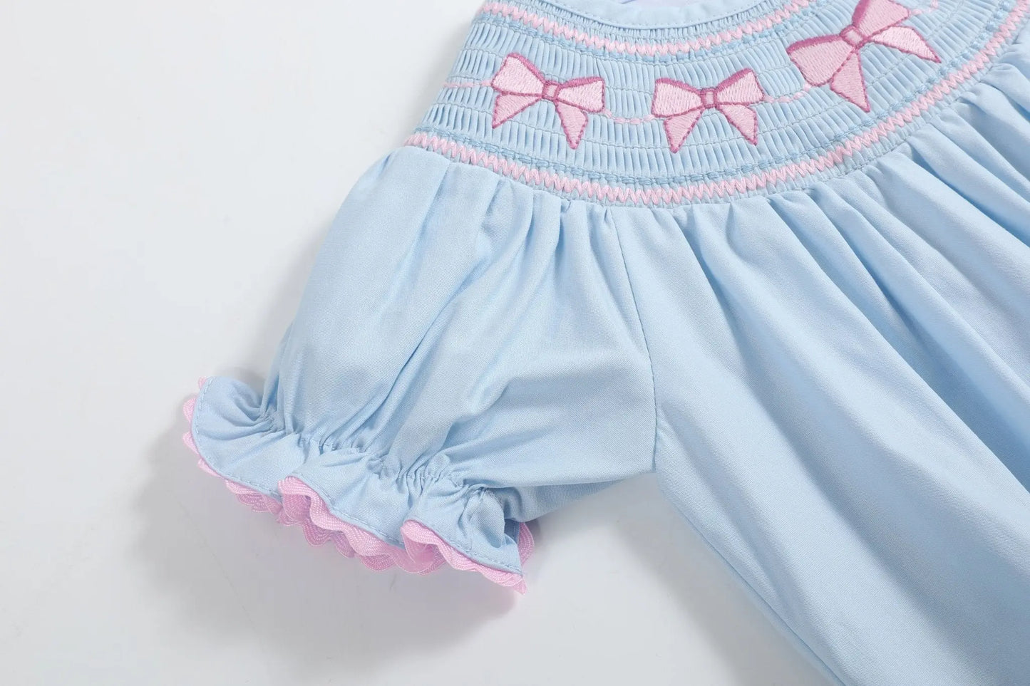 Blue and Pink Bow Smocked Romper Lil Cactus