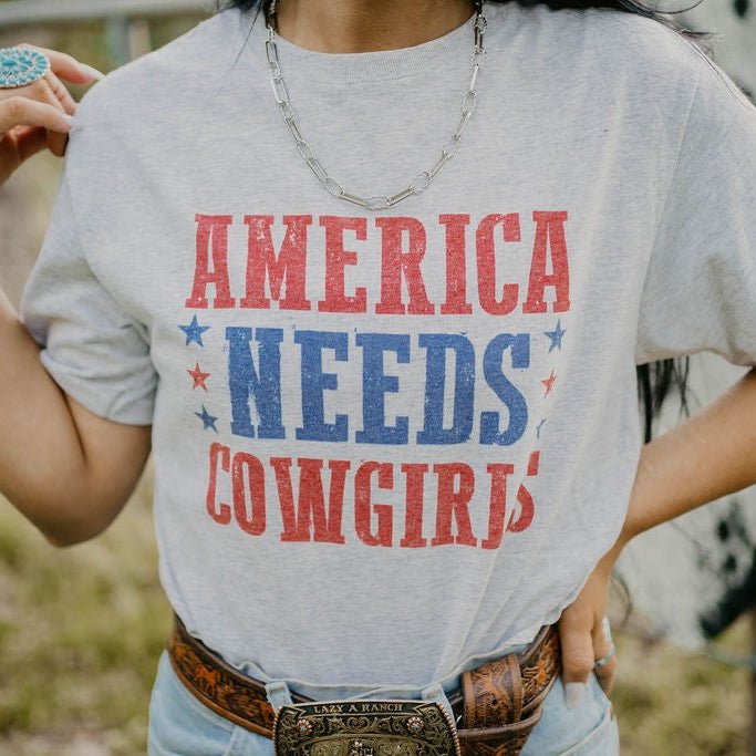 America Needs Cowgirls Graphic Tee